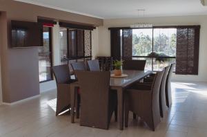 a dining room with a table and chairs at 50 HALE HAVEN in Stanthorpe +8 photos