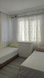 Postel nebo postele na pokoji v ubytování Lux triplex villa in Antalya for families
