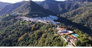 an aerial view of a town in the mountains at Casa Alameda in Benarrabá