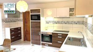 Lipno Apartments Exclusive tesisinde mutfak veya mini mutfak