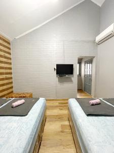 En eller flere senge i et værelse på Otu Hostel By Ostic