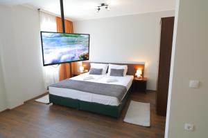Postel nebo postele na pokoji v ubytování Fenix Apartments