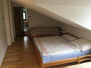 Una cama o camas en una habitación de Apartman - Rokytnice nad Jizerou