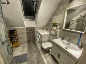 Kúpeľňa v ubytovaní Apartamenty Eksploris II