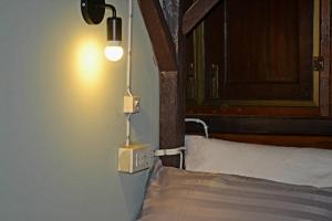 Voodi või voodid majutusasutuse Baan Suan Taboon Homestay toas