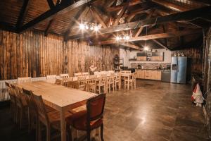 a large dining room with a table and chairs at Vama veche de la Bran in Bran