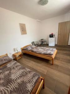 Łóżko lub łóżka w pokoju w obiekcie Ubytování Valtík