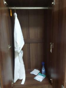 a bathroom with a towel hanging on a wall at Studio for Rent near Ortigas Extension in Cainta