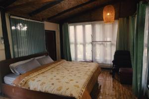 Postelja oz. postelje v sobi nastanitve Baan Suan Taboon Homestay