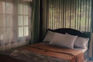 Voodi või voodid majutusasutuse Baan Suan Taboon Homestay toas
