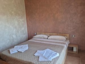 Postel nebo postele na pokoji v ubytování Vista Allaro