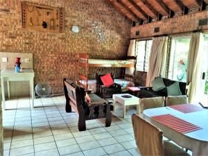 a living room with a couch and a table at St Lucia Wilds in St Lucia