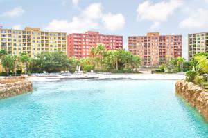 a river in front of buildings and a beach at Golf Porto Marina Hotel Apartments Al Alamein in El Alamein