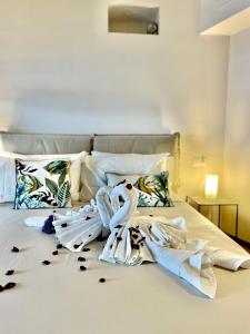 Postel nebo postele na pokoji v ubytování Corallini Luxury Apartments Shiro