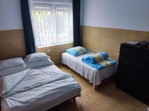 Posteľ alebo postele v izbe v ubytovaní Willa Zefirek