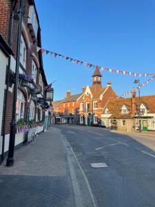 an empty street in a town with buildings at Roundhill New Forest in Fordingbridge