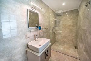 a bathroom with a sink and a shower at Flower Hotel Patara in Patara