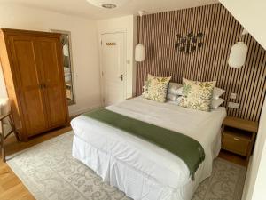 a bedroom with a large bed in a room at Beach Lodge in Bournemouth
