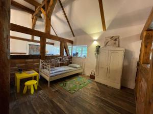 Postel nebo postele na pokoji v ubytování Idyllische Ferienwohnung auf dem Land