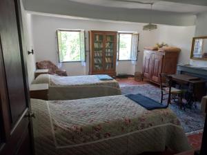 Postel nebo postele na pokoji v ubytování Maison de caractère