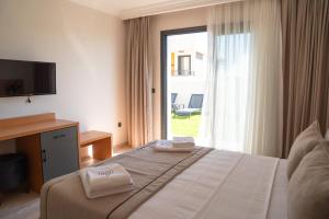 Postel nebo postele na pokoji v ubytování Nova Butik Hotel Çeşme
