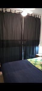 A bed or beds in a room at Ático Roquetas