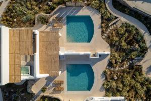 an overhead view of two swimming pools at Blue Pearls-Adults Only Luxury Suites in Kos