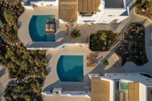 an overhead view of a swimming pool next to a building at Blue Pearls-Adults Only Luxury Suites in Kos Town