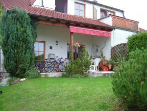 a house with bikes parked on the front of it at Haus Renia in Markdorf