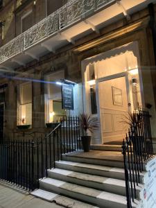 a building with a staircase leading to a door at Marina Court in Weymouth