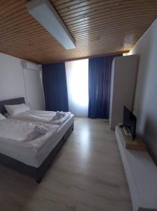 Postel nebo postele na pokoji v ubytování Vila Oska