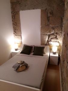Cama ou camas em um quarto em Casa da Florbela