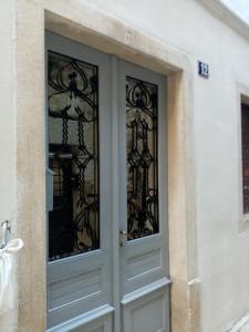 a front door of a house with glass at San Eleuterio Guesthouse in Poreč