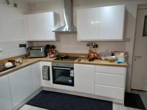 Kuchyň nebo kuchyňský kout v ubytování Cozzy Accommodation + 23 fotografií