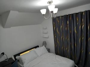 Postel nebo postele na pokoji v ubytování Cozzy Accommodation