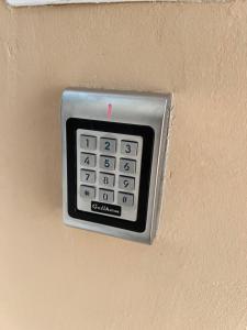 a remote control on the wall of a room at City Apartment 1 in Vienna