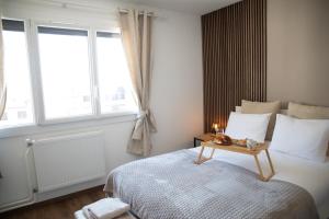 Posteľ alebo postele v izbe v ubytovaní L'ÉLÉGANCE DU VIGNY + 27 fotografií