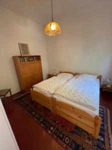 Säng eller sängar i ett rum på Ferienhaus Helios