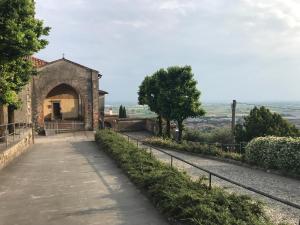 a path leading up to a building with a gate at Annunciata Soul Retreat in Coccaglio