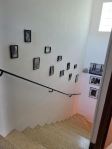 a staircase with pictures on the wall at Maison Gemenos in Gémenos