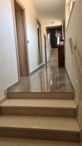 a hallway with stairs in a building at Villa Queen in Zadar