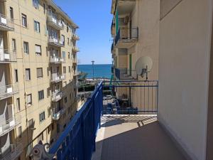 a view of the ocean from a balcony of a building at Residenza Tafuri in Salerno
