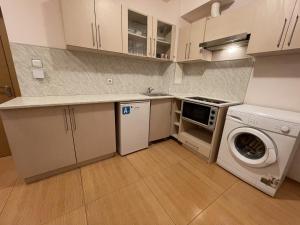 A kitchen or kitchenette at Menada Grand Kamelia Apartments