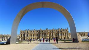 a large building with people walking in front of it at Les Versaillaises B&B in Versailles