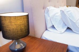 A bed or beds in a room at Casa Reale Corfu