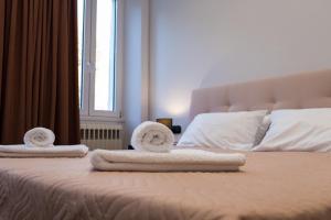 A bed or beds in a room at Casa Reale Corfu