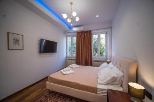A bed or beds in a room at Casa Reale Corfu