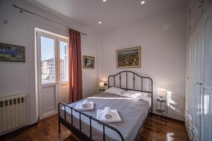 A bed or beds in a room at Casa Reale Corfu