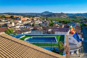 an aerial view of a house with a swimming pool at Hotel Sierra de Huesa in Huesa