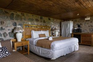 Säng eller sängar i ett rum på Hacienda Margarita